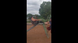 Woman Goes Backward Down Playground Slide