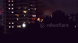 Fire breaks out in 10th floor flat in Westland House on Rymill Street in North Woolwich with flames licking up the side of the building