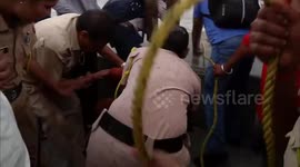 Police save elderly woman from drowning in sea