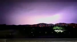 Thunderstorm illuminates night sky with purple hues in China