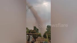 Huge landspout tornado stretches to the sky