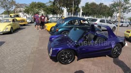 Old cars are parked to be admired by collectors and people who like this modality