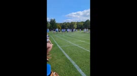 Man in wheelchair earns applause as he finishes last in dad's race at son's school