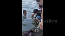 Heroic bystanders save boy trapped in underwater pipe in China