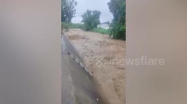 Resident swept away by flash flood into river rescued