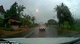 Pickup truck rams lorry along slippery road in Thailand