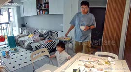 Chinese father takes a tumble after 1-year-old daughter moves chair unwittingly