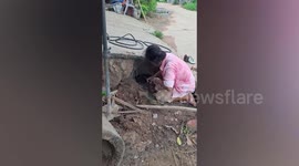 Grandmother digs through pipe to save puppy