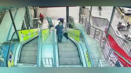 Elderly Chinese woman rolling down escalator rescued by quick-thinking chef