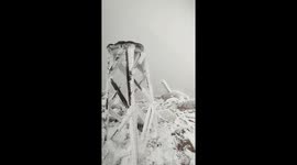 Rare snowfall blankets Cerro Tres Picos amidst fog in Buenos Aires