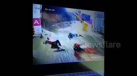 Shocking moment flash floods sweep residents into parking garage in China