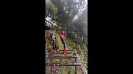 Spiderman takes zip line across 850ft high waterfall in Laos
