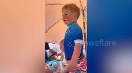 Sports-mad tot wows beachgoers with perfect rendition of God Save the King