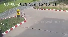Motorbike rider and passenger crashes through signboard trying to enter gas station