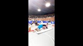 Thai masseuse stretches woman at massage tournament in Japan