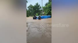 Inflatable paddling pool saves family during floods in Malaysia