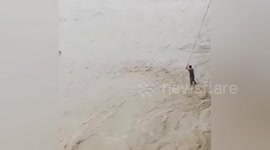 Indian villagers rescue baby elephant trapped in severe floods