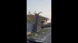 Snapped utility pole makes road to La Vue Hotel impassable after the passage of hurricane Beryl in St Vincent and the Grenadines