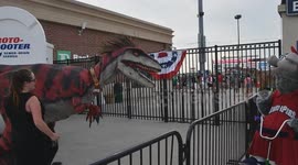 dinosaur Roman chases FEFE at a baseball game