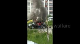 Heroic neighbours rescue driver trapped in fiery car explosion in China