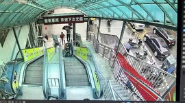 Heroic Chinese shopper rescues elderly woman from terrifying escalator fall in supermarket