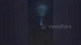 Strange light in sky that sparked alien fears turn out to be plane flying through thick clouds
