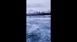 Extreme winds carry away a photographers tripod on a frozen lake in Canada