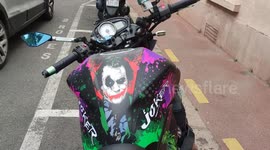 Motorcycle painted in the colors of the Joker in Batman. Paris suburb, Saint-Germain-en-Laye, near Versailles, France.