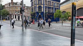 CRAZY - Tooley Street - London - Cyclist blatantly ignoring RED LIGHT and just cycling through them, even as people were STILL CROSSING!