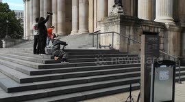Some skateboarding fails and falls as a skateboarder attempts to skate down a handrail on St Pauls Cathedral