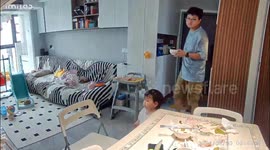 Toddler sneakily pulls dad's chair away as he sits down to eat