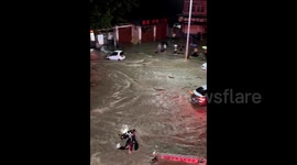 Raging floodwaters sweep scooter rider away in eastern China