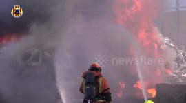 Spain: Firefighters Battle Intense Blaze at Scrap Metal Company in Spain