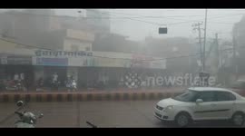 India: High voltage electricity pole fell on a moving car, captured on camera
