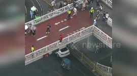 China: Dramatic Rescue as Officer Prevents Bridge Jump