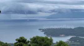 Stunning waterspout tornado hovers over islands in the Philippines