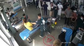 Male nurse risks bad injury as he snatches knife from female patient's hands