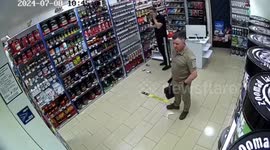 CCTV footage shows Kyiv locals cowering in shop as Russian missiles target city