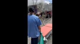 Dramatic footage shows emergency services on scene after Russian missiles hit children's hospital in Kyiv