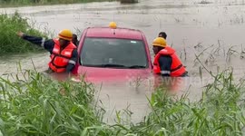 Rescuers save car trapped in flood amidst heavy rains in southern India