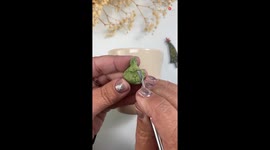 Polymer Clay artist decorates mug with The Grinch and Max in festive holiday scene