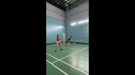 Shocked badminton players find snake curled up on court