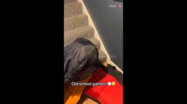 Playful stair-sliding game unites generations in a joyful family moment
