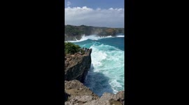 INSANELY strong wave reminds daring woman of the dangers of getting too close to the edge