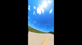 Motorcyclist's Grassy Dismount