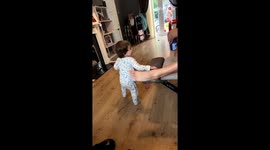 Little boy looks at his dad's reaction to England's goal in Euro 2024
