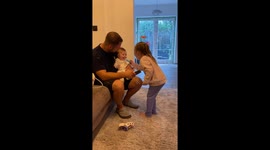 Sister's doctor play makes a little girl burst with laughter