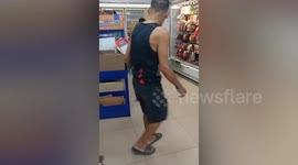 Monitor lizard trying to escape dog by hiding in convenience store caught