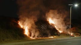 USA: Firefighters Combat Brush Fire in Porter Ranch