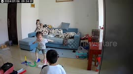 Lightshade falls on girl's head after being knocked down by toy rocket in China